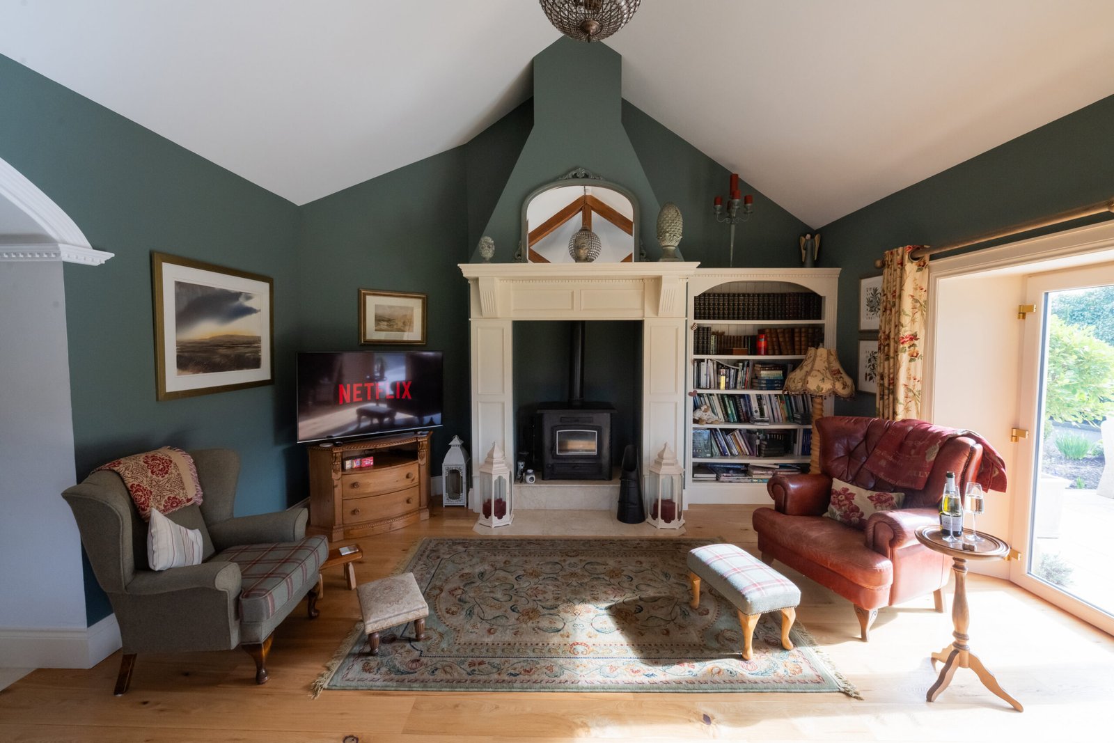 Comfortable sitting room with fireplace at Lavender Manor